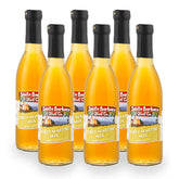 Six bottles of Santa Barbara Olive Co. Dirty Martini Mix on a white background