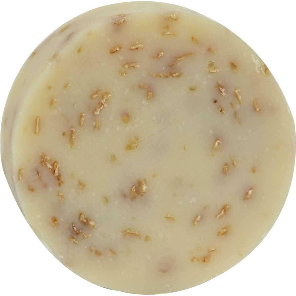 Oatmeal natural bar soap round shape with oats and a creamy texture, ideal for gentle cleansing.