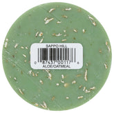 glycerine cream aloe oatmeal soap with textured surface and label details on the round soap bar.