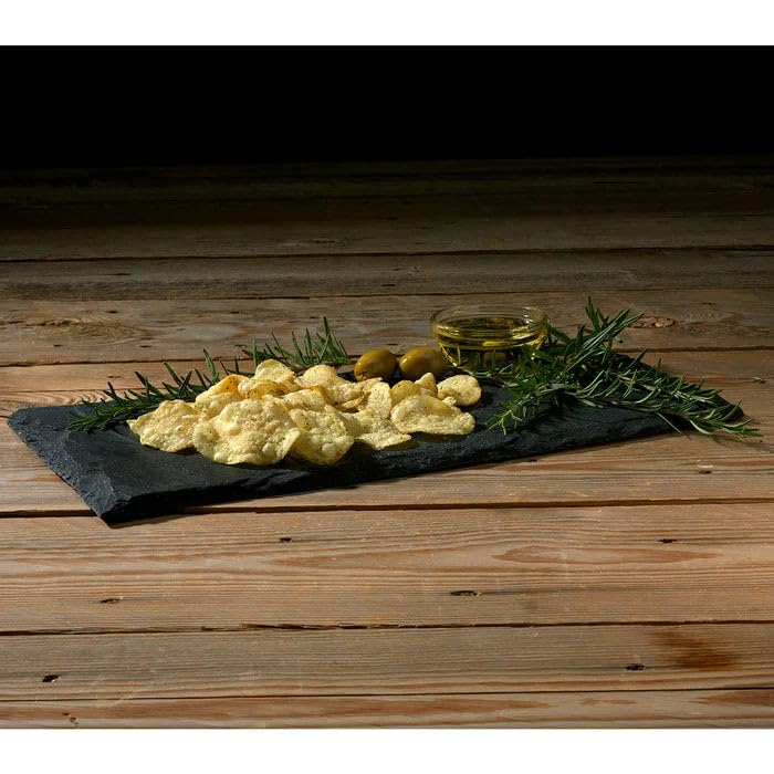 rosemary olive oil kettle chips served on a slate platter with olives and extra virgin olive oil, garnished with fresh rosemary
