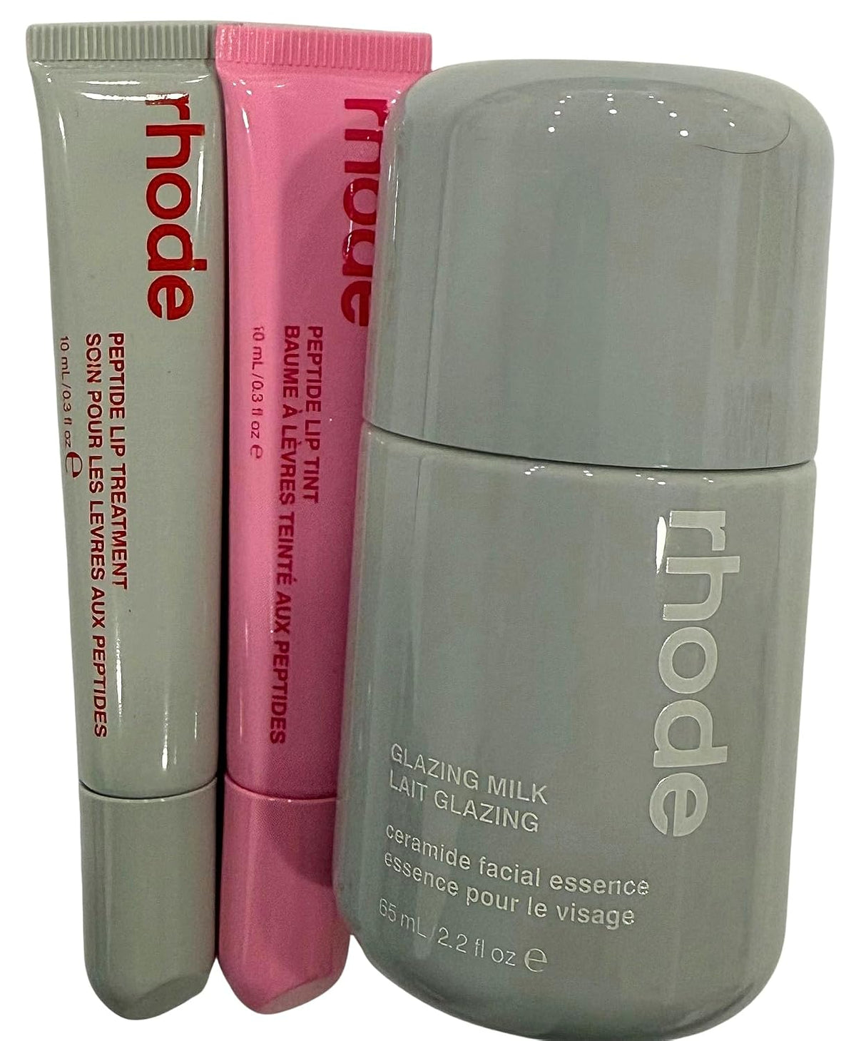 Rhode glazed lip care trio set featuring Glazing Milk and two Peptide Lip Treatments for hydrated lips.