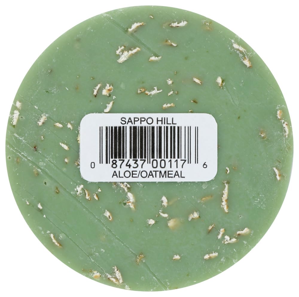 glycerine cream aloe oatmeal soap with textured surface and label details on the round soap bar.
